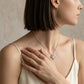Model wearing heart shaped moissanite openwork gourd clover pendant necklace.