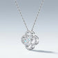 Perspective view of heart shaped moissanite openwork gourd clover pendant necklace on slate.