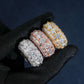 Hand wearing black glove holding S925 silver iced out round baguette moissanite 3-row band rings   