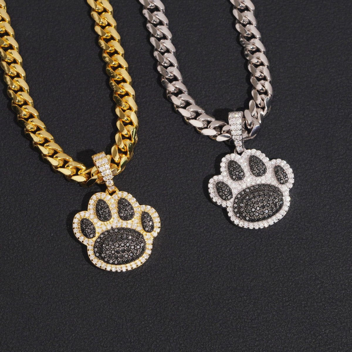 Hip hop S925 silver iced out moissanite animal paw print pendants in gold and silver on dark surface
