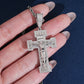 Hand holding S925 sterling silver full iced out moissanite baguette crucifix cross hip hop pendant