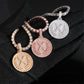Hand wearing black glove holding S925 silver iced out moissanite letter X medallion hip hop pendants with chains   