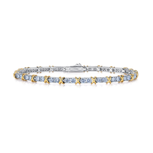 Two-tone hugs and kisses XO moissanite tennis bracelet isolated on white background