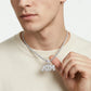 High-end hip-hop lookbook view of a male model wearing an iced out ATM moissanite pendant on a tennis chain.