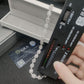 Diamond selector tester device testing silver iced out baguette halo moissanite tennis chain with GRA certificate