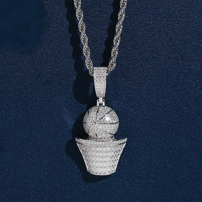 Iced out basketball and hoop moissanite baguette pendant in sterling silver on rope chain resting on dark blue background