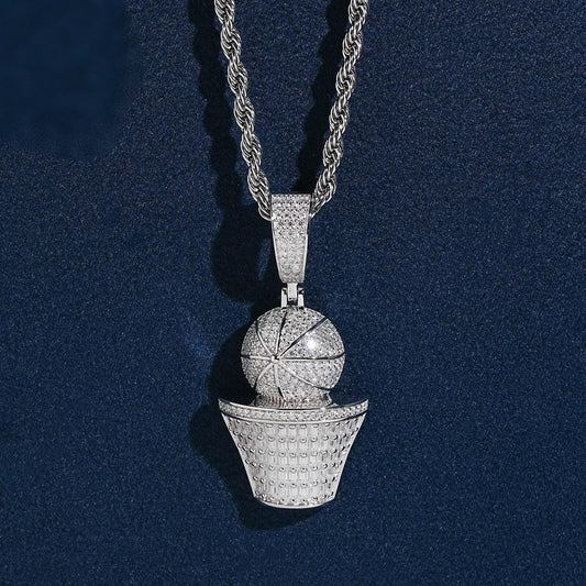 Iced out basketball and hoop moissanite baguette pendant in sterling silver on rope chain resting on dark blue background