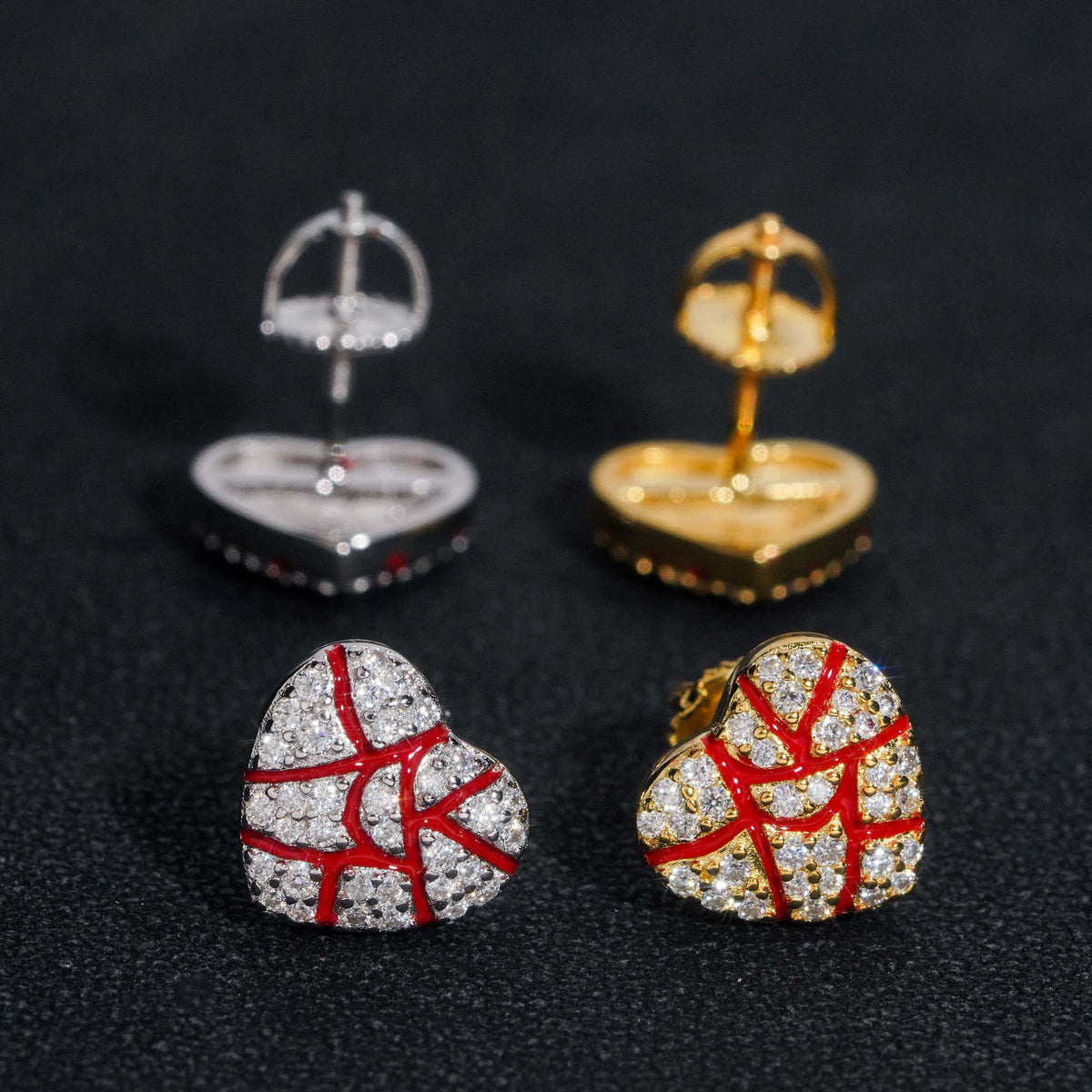 Iced out broken heart red enamel moissanite stud earrings displayed with GRA certificate card   