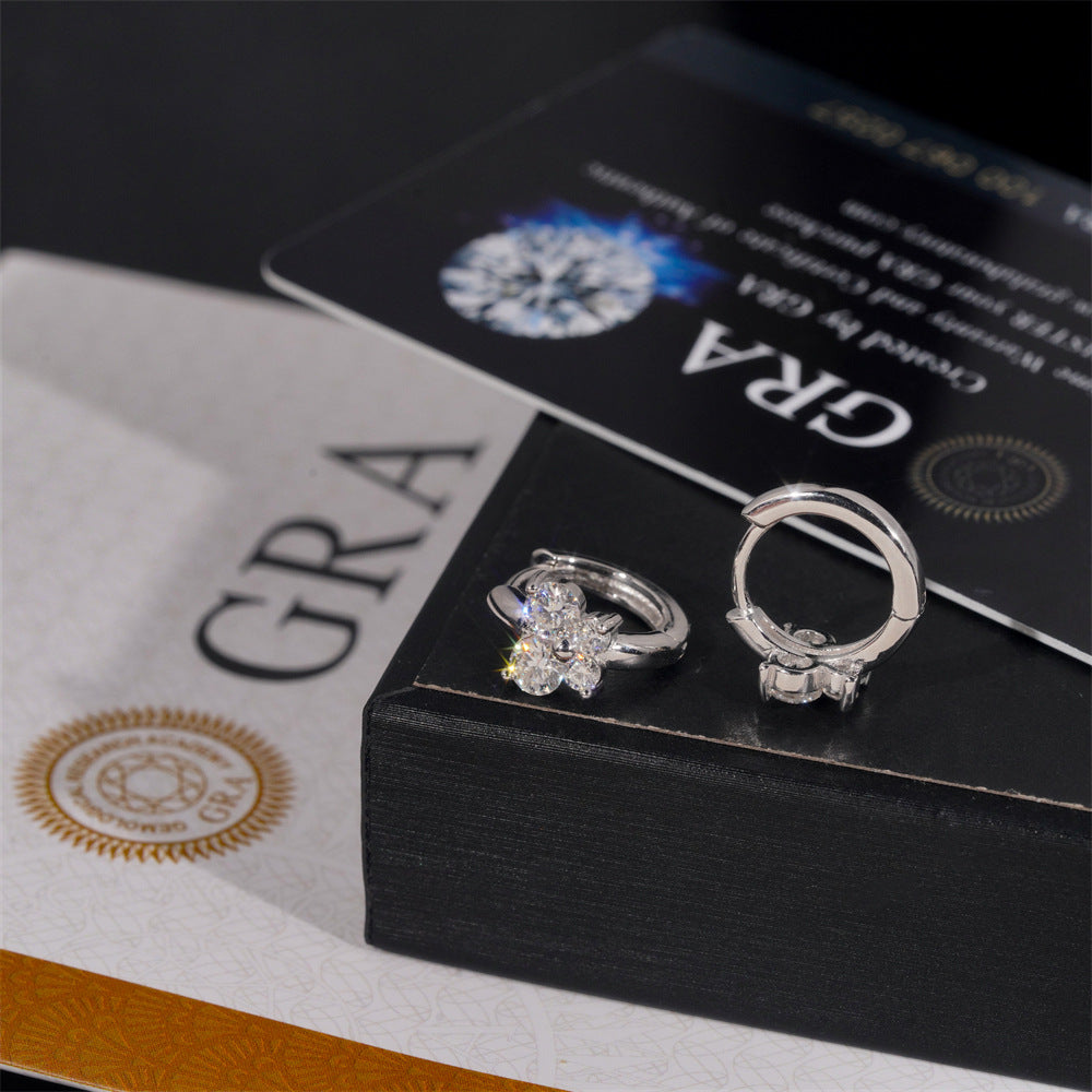 Clear iced out butterfly cluster huggie hoop moissanite earrings on jewelry gift box with GRA report card   