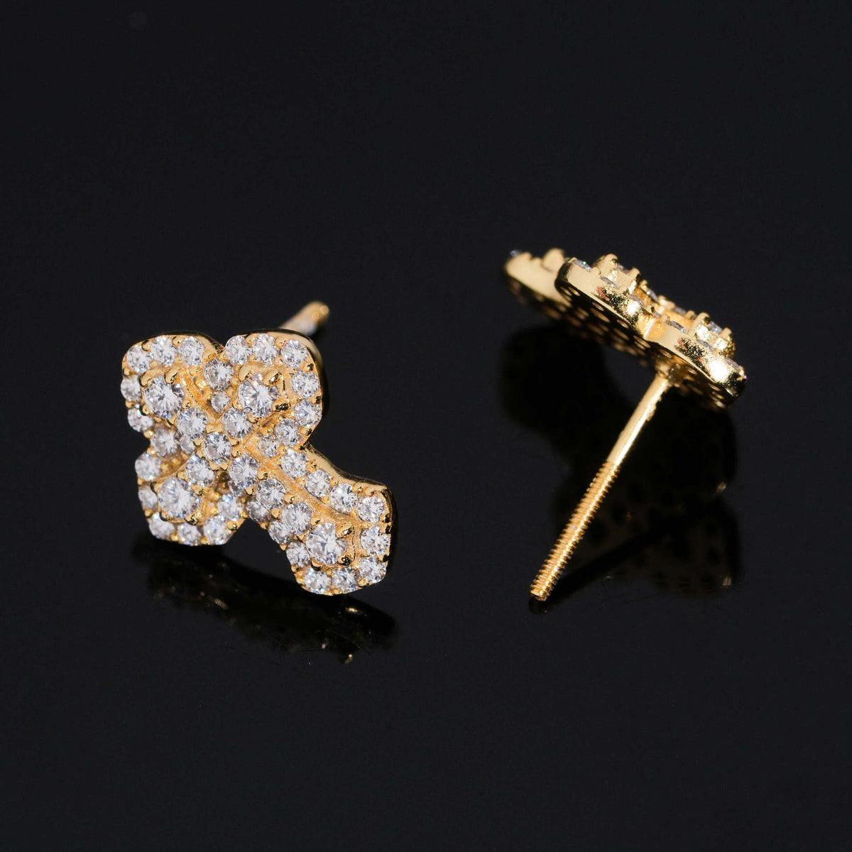 Side profile view of iced out clover floral micro-pave moissanite stud earrings showing threaded post and back
