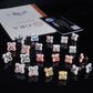 Assorted colorful four-leaf clover moissanite stud earrings arranged on GRA certificate card