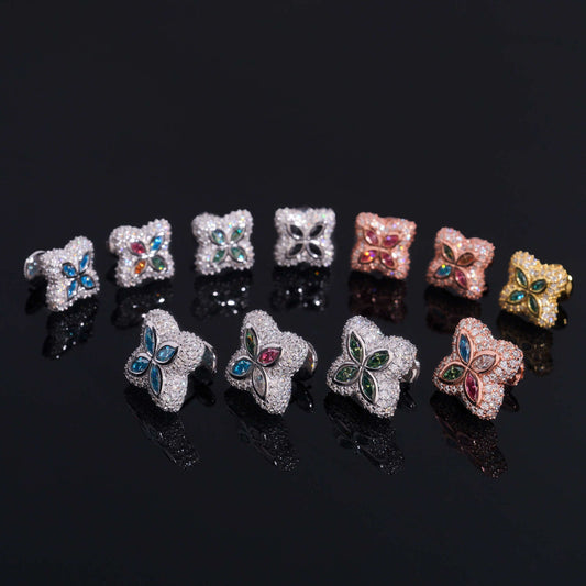 Iced out colorful four-leaf clover moissanite stud earrings in multi-color gemstone variations on black background