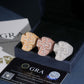Three color iced out cross moissanite baguette statement rings displayed in black gift box with GRA card