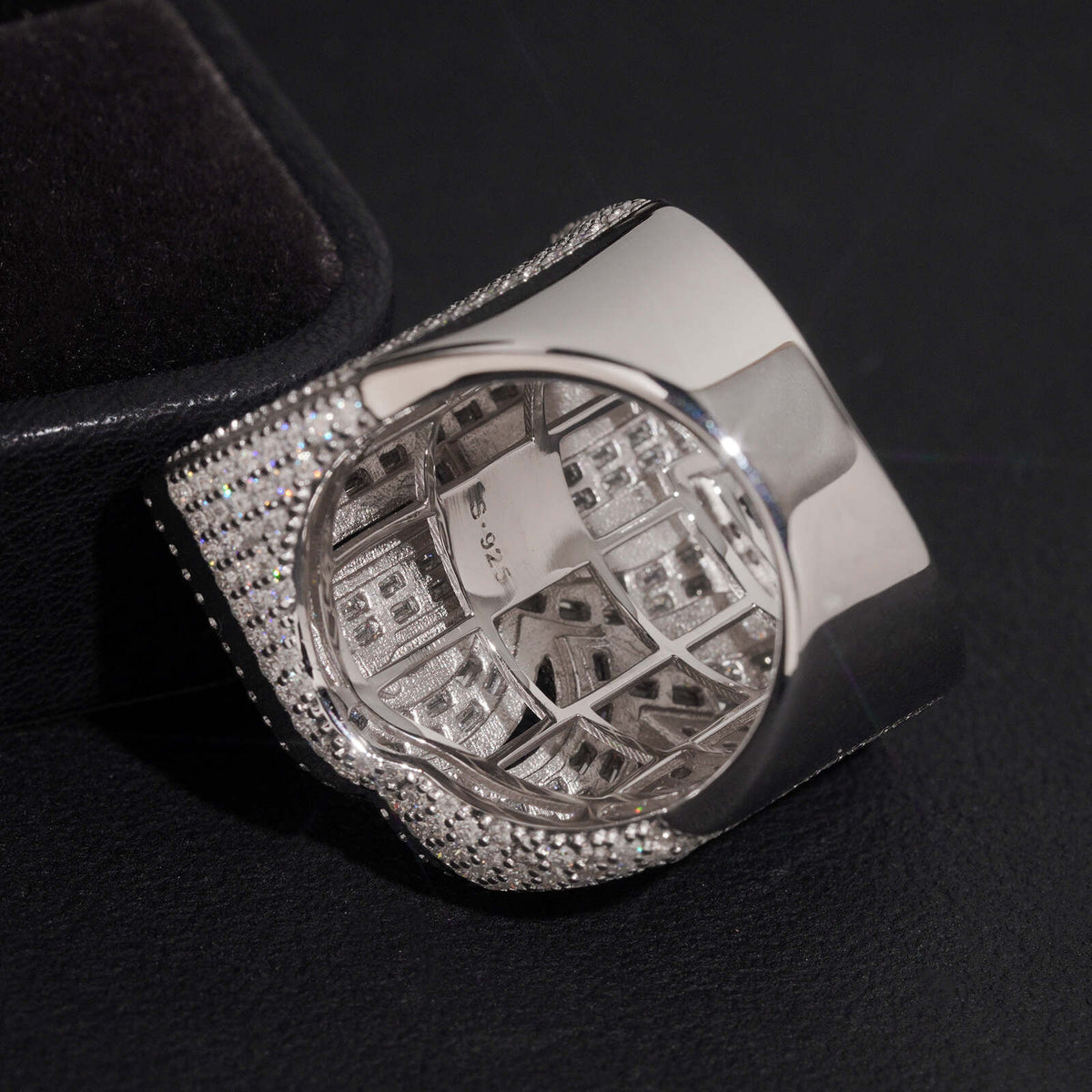 Back view showing solid inner band structure of iced out double letter RR moissanite ring