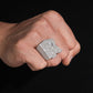Person wearing iced out double letter RR moissanite baguette ring on hand