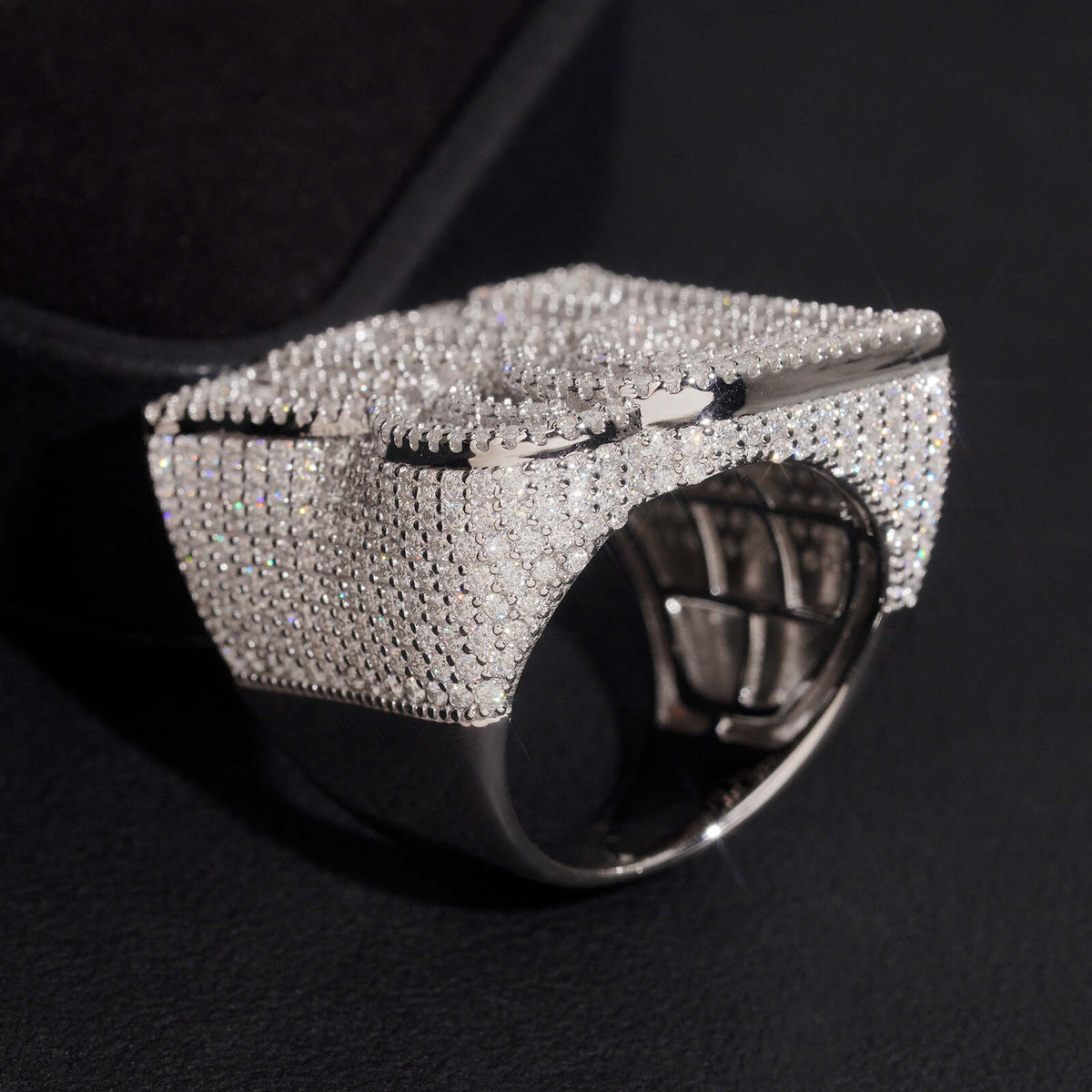 Side view showing thick band and pave moissanite settings of double letter RR ring