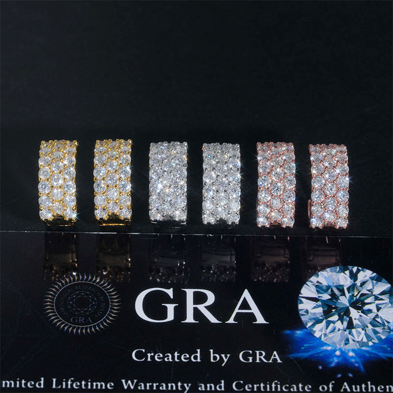 Iced out double row moissanite huggie hoop earrings in yellow gold, silver, and rose gold on GRA card