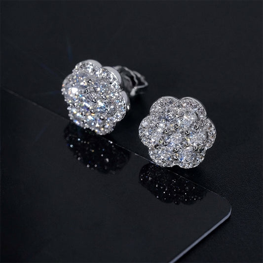 Iced out flower cluster moissanite stud earrings in silver on dark reflective card