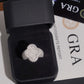 Iced out four-leaf clover moissanite ring presented in black jewelry box with GRA certificate