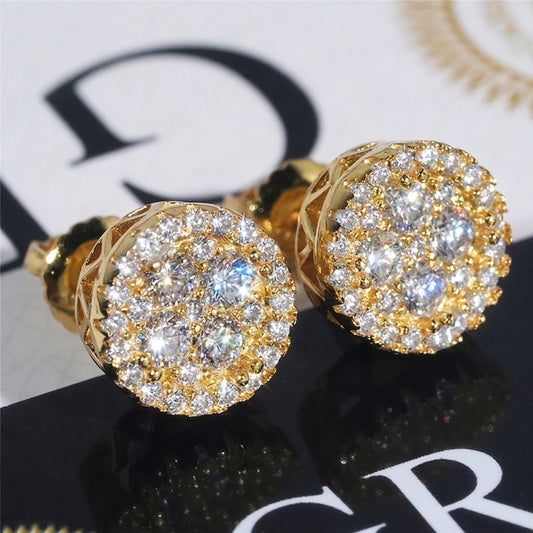 Iced out yellow gold round cluster moissanite stud earrings with filigree basket on dark reflective background