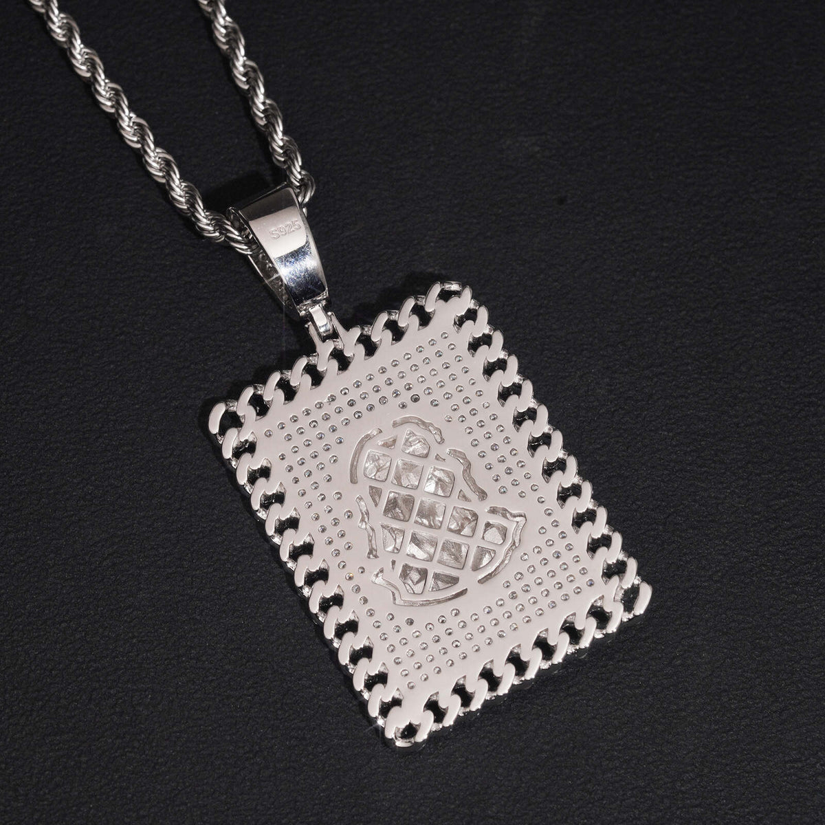 Front view showing detailed jesus face motif and pave moissanite dog tag border