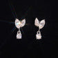 Silver iced out marquise leaf dangle solitaire moissanite stud earrings sparkling on dark background   