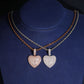 S925 silver iced out moissanite 3D puffed heart pendant necklaces in silver and rose gold displayed on neck bust   