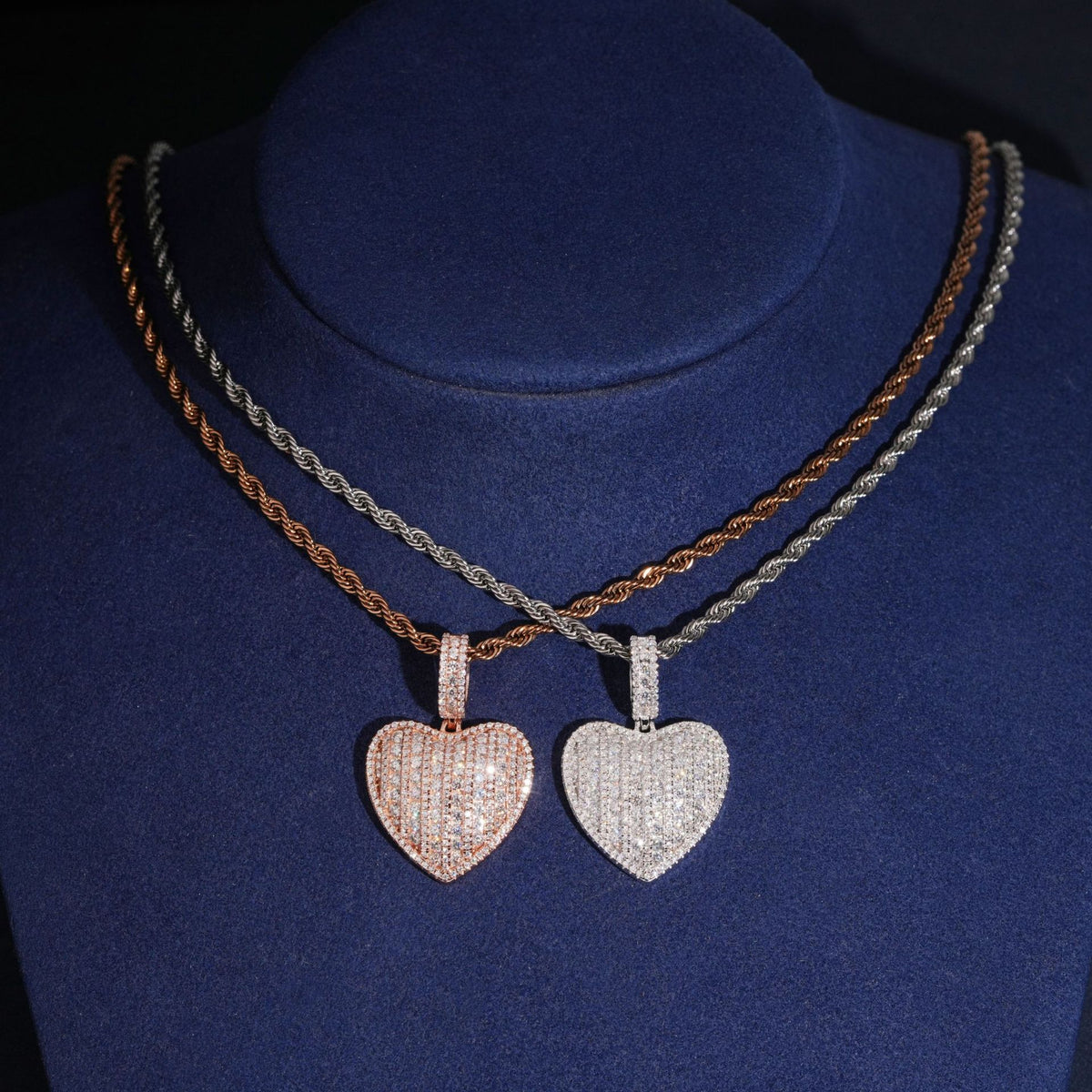 S925 silver iced out moissanite 3D puffed heart pendant necklaces in silver and rose gold displayed on neck bust   