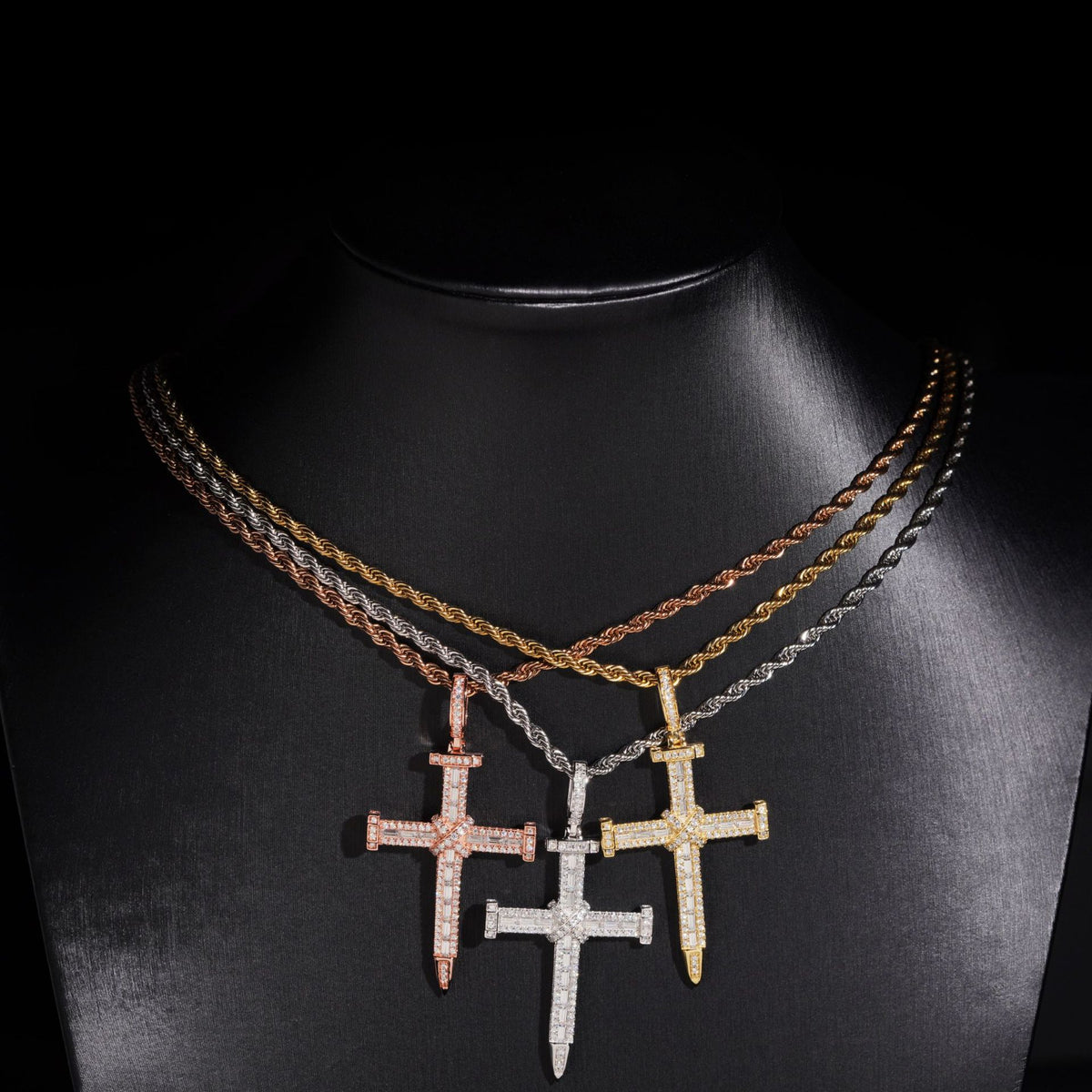 Three-color S925 silver iced out moissanite baguette cross pendant necklaces displayed on jewelry neck bust
