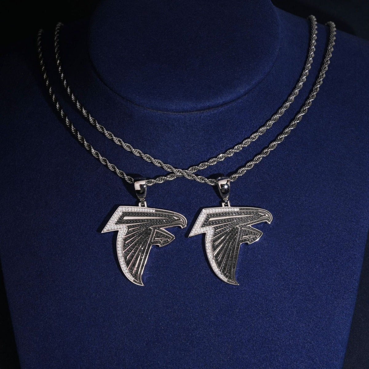 S925 silver iced out moissanite falcon bird logo pendant necklaces in two sizes displayed on neck bust
