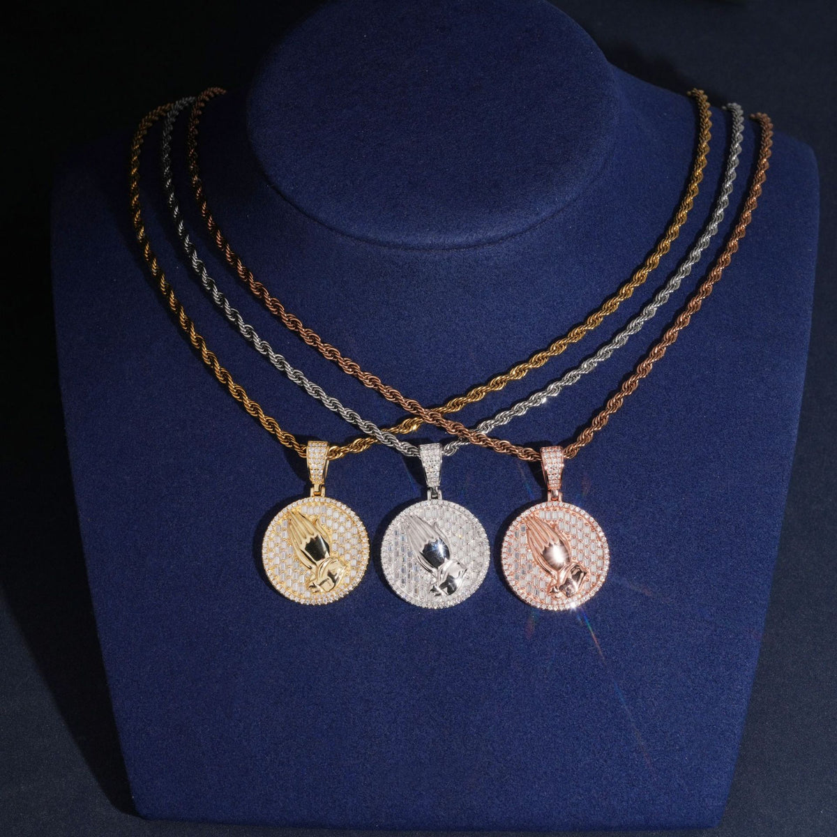 Three-color 925 silver iced out moissanite praying hands medallion pendant necklaces displayed on jewelry neck bust