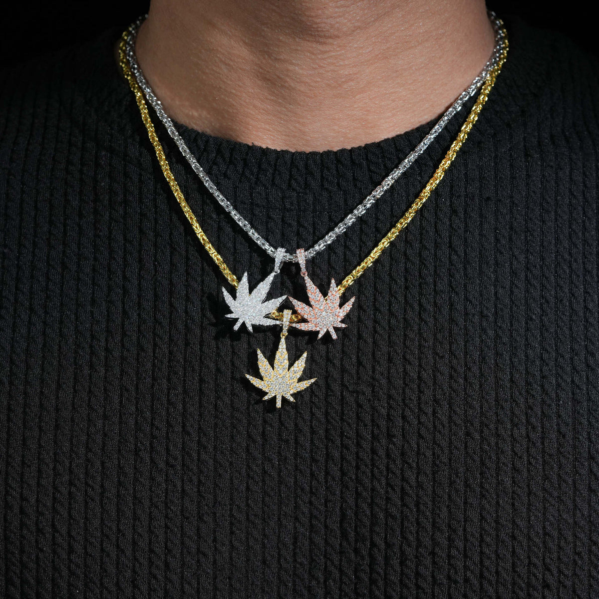Model wearing layered 925 sterling silver iced out moissanite weed leaf pendant necklaces