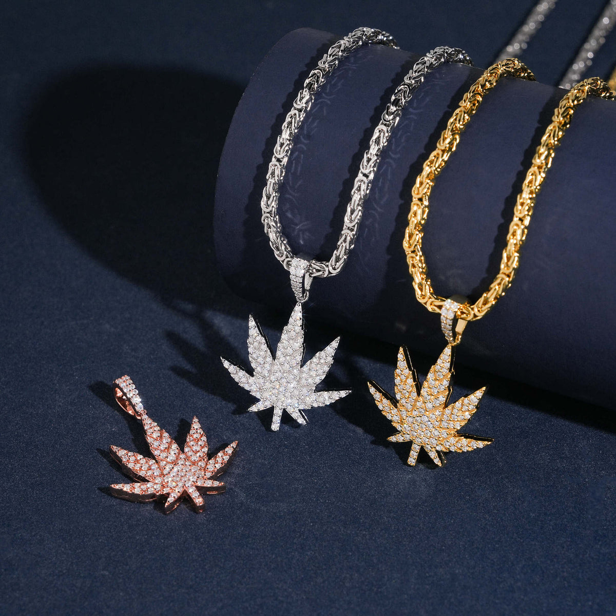 925 sterling silver iced out moissanite weed leaf pendants hanging on gold silver and rose gold chains