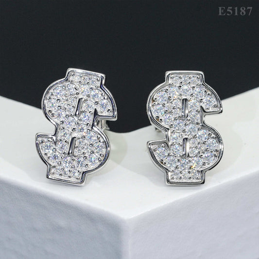 Iced out money sign dollar sign moissanite stud earrings in silver on white pedestal tray