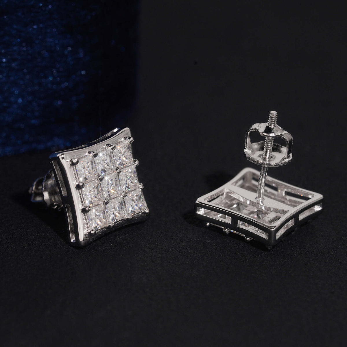 Silver iced out princess cut square cluster moissanite stud earrings showing posts and screw backs