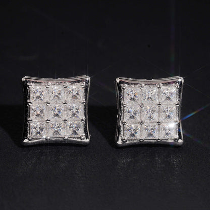 Iced out princess cut square cluster moissanite stud earrings sparkling on dark background