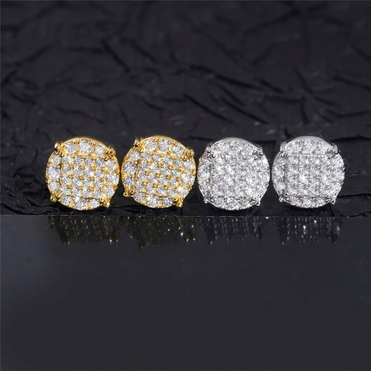 Iced out round disc micro-pave moissanite stud earrings in yellow gold and silver on black background