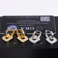 Iced out square cushion hollow drop huggie hoop moissanite earrings in gold and silver in front of GRA card