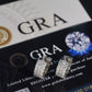 Silver iced out triple row moissanite huggie hoop earrings displayed on official GRA report card