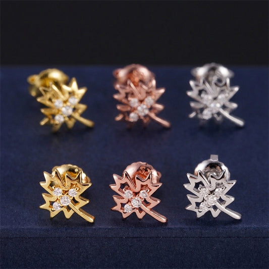 Iced out weed leaf maple leaf moissanite stud earrings in yellow gold, rose gold, and silver on blue display box