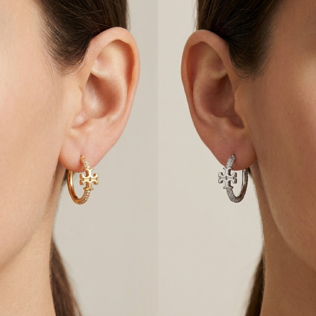 ZERRA Tory Burch Small Eleanor gold logo hoop earrings with monogram design, showcasing a stylish and elegant earring silhouette.