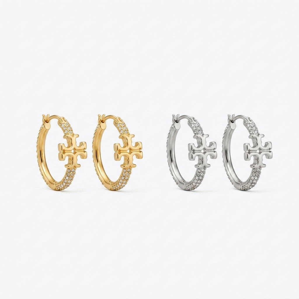 ZERRA Tory Burch Small Eleanor gold logo hoop earrings with monogram design, showcasing a stylish jewelry accessory.
