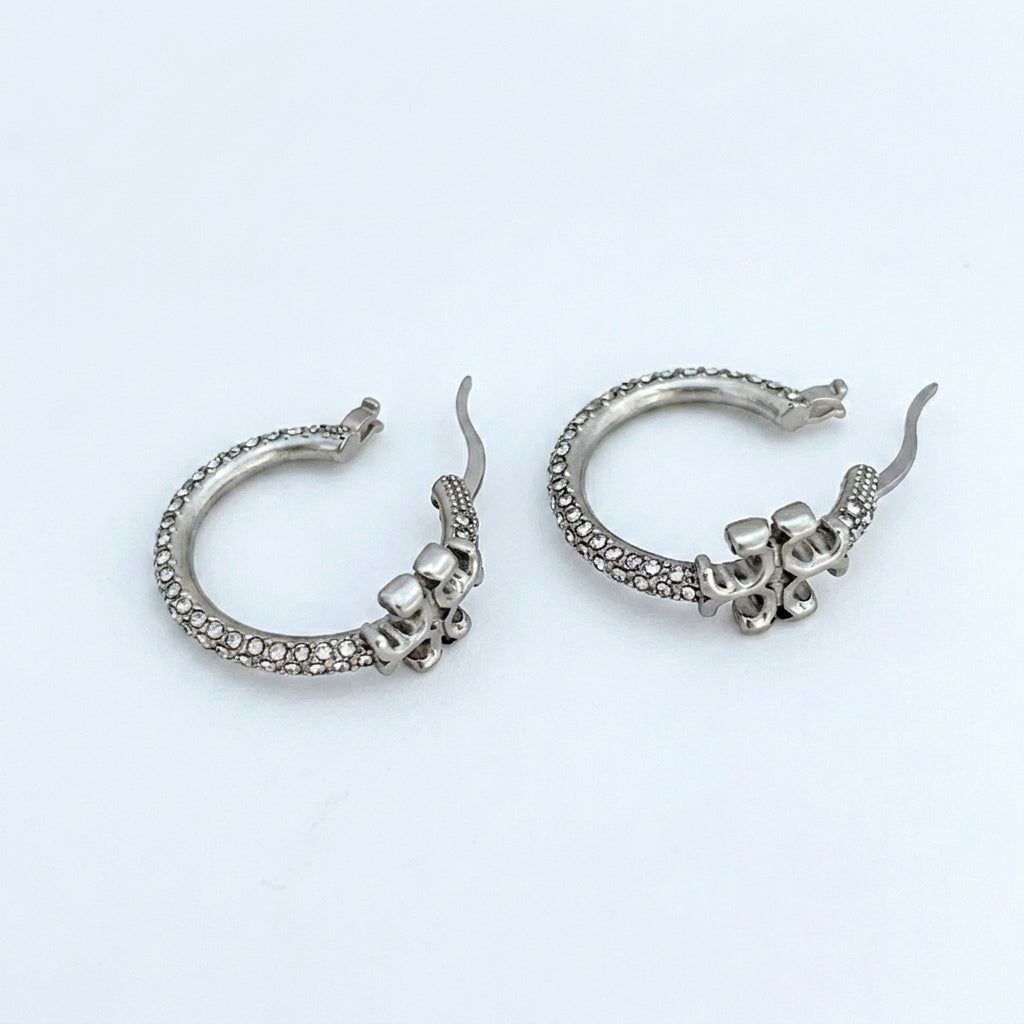 ZERRA Tory Burch Small Eleanor gold logo hoop earrings with monogram design, featuring a classic hoop style and polished finish.