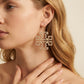 Zerra Jewelry large Tory Burch logo earrings featuring double T design with pave crystals, stylish and elegant accessory.