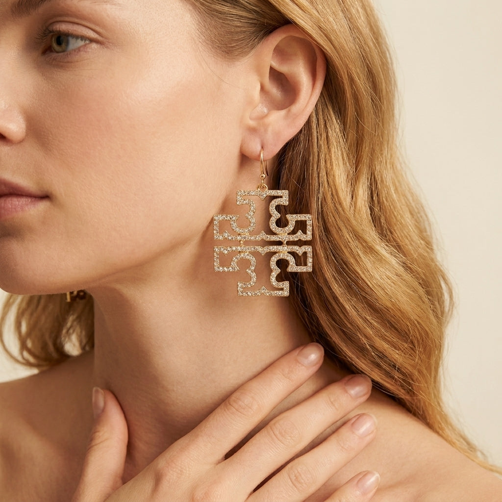 Zerra Jewelry large Tory Burch logo earrings featuring double T design with pave crystals, stylish and elegant accessory.