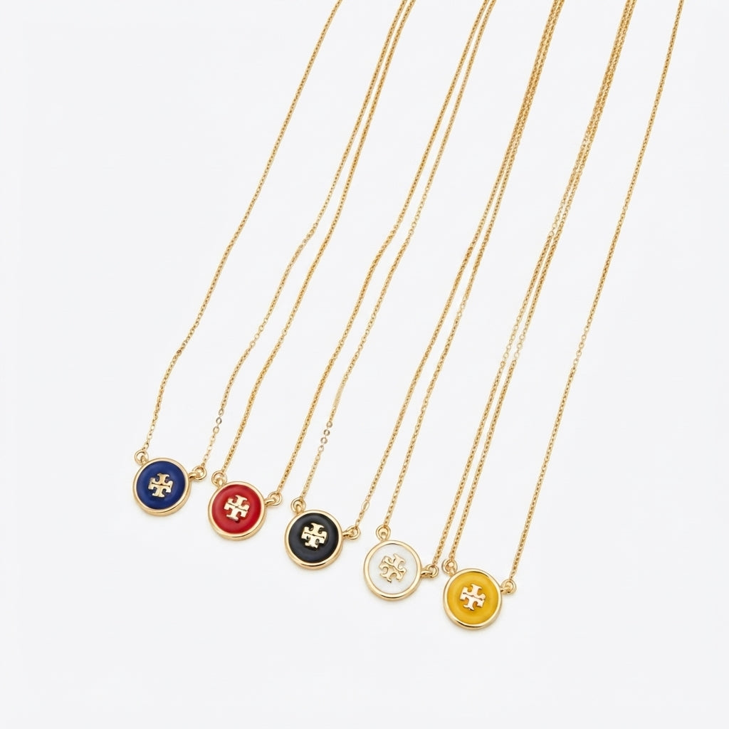 Zerra Jewelry Tory Burch Kira enamel pendant necklace with color block design, featuring a stylish and modern jewelry piece.