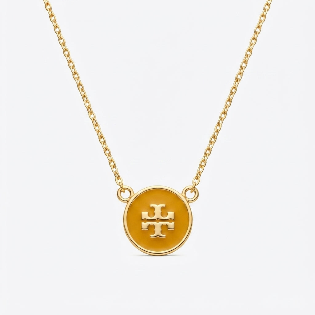 Zerra Jewelry Tory Burch Kira enamel pendant necklace with color block design, featuring a stylish, modern jewelry piece.