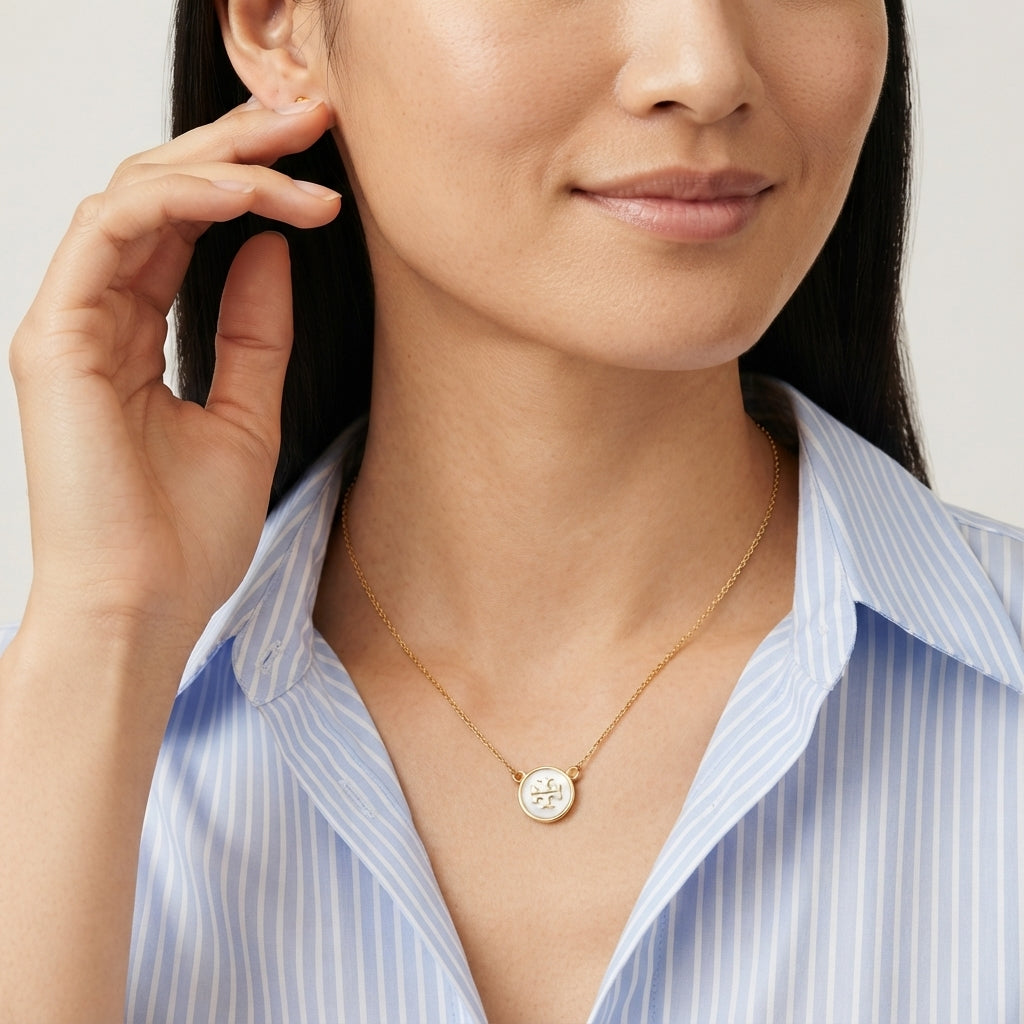Tory Burch Kira enamel pendant necklace by Zerra Jewelry featuring a color block design on a sleek necklace chain.