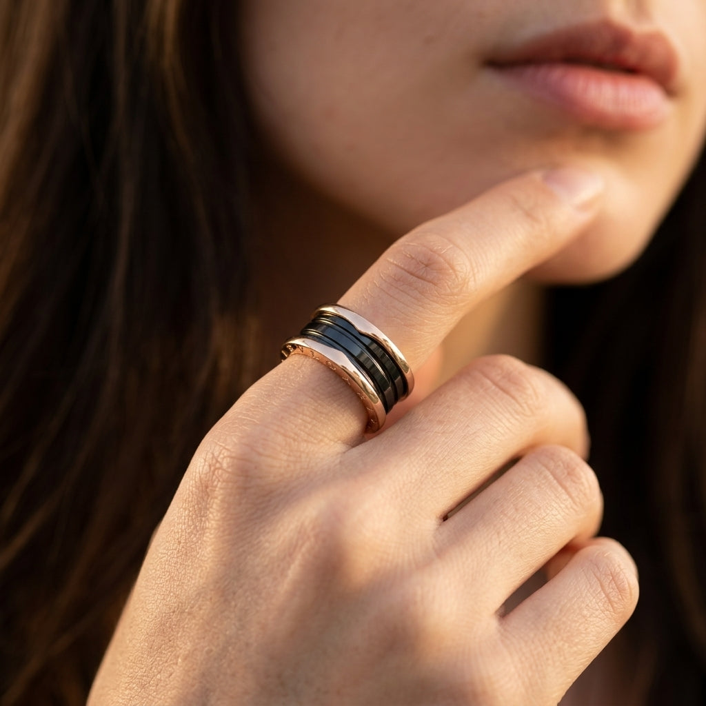 Bulgari B.zero1 three-band ring with black ceramic spiral design, showcasing sleek, modern jewelry from Zerra Jewelry.