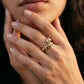Zerra Jewelry Cartier Panthère de Narrow ring with garnets and black lacquer accents, elegant designer jewelry piece.